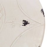 Cream-colored round metal bar table with a textured surface featuring subtle black accents and intricate detailing. The table has a sleek, modern design suitable for various home decor styles