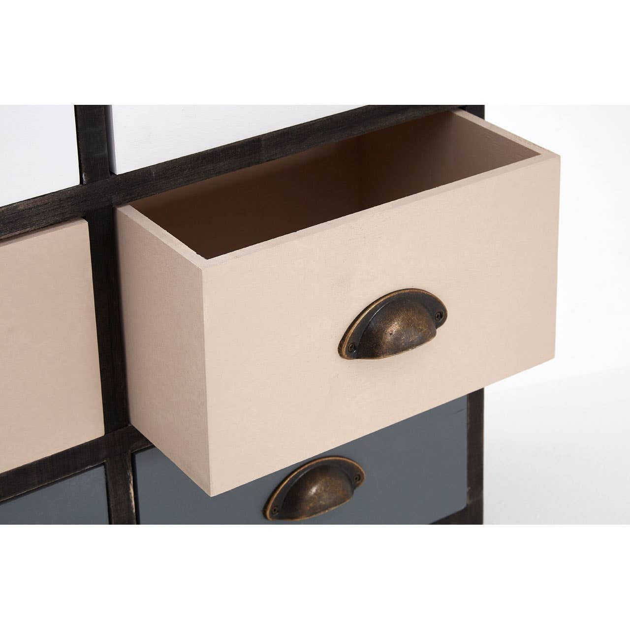 A close-up view of a beige drawer from the Urban Loft 6 Drawers Chest, featuring a rounded bronze handle and a smooth surface, set against a contrasting dark frame. The interior of the drawer is visible, showcasing a rich brown color