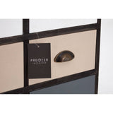 A close-up view of a drawer from the Urban Loft 6 Drawers Chest, featuring a sleek black handle and a beige panel. A tag hangs from the drawer, displaying the brand name. The background is a light color, highlighting the modern design of the chest