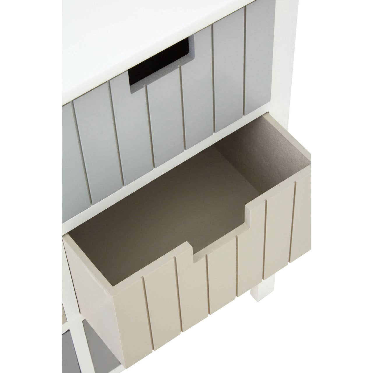 A top-down view of the New England White 6 Drawers Chest, showcasing the upper section with a smooth white surface and a gray panel behind it. Below, a beige storage bin with a slotted design is visible, providing additional storage space. The overall design features clean lines and a modern aesthetic