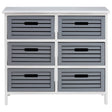 A six-drawer unit with a light grey finish, featuring horizontal slats on the drawer fronts and cut-out handles. The unit is supported by slender legs and has a smooth top surface, suitable for home decor or storage