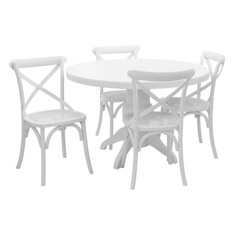 Round dining table with a white wash finish, accompanied by four matching chairs featuring cross-back designs. The table has a sturdy pedestal base, and the overall set showcases a clean, modern aesthetic suitable for various dining spaces