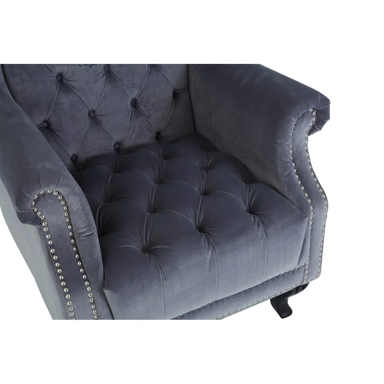 Grey velvet armchair with tufted seat and back, silver stud trim, partial top view