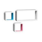 Three floating wall cubes in white, featuring one large rectangular cube and two smaller square cubes. The smaller cubes have colored interiors, one in blue and the other in pink, creating a modern and stylish display option for home decor