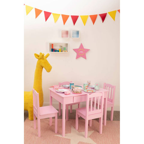 Three white floating wall cubes arranged in a playful, colorful children's room featuring a pink table and chairs set, a yellow giraffe decoration, and a festive banner of triangular flags hanging above. The walls are adorned with a star-shaped decoration and various colorful art supplies
