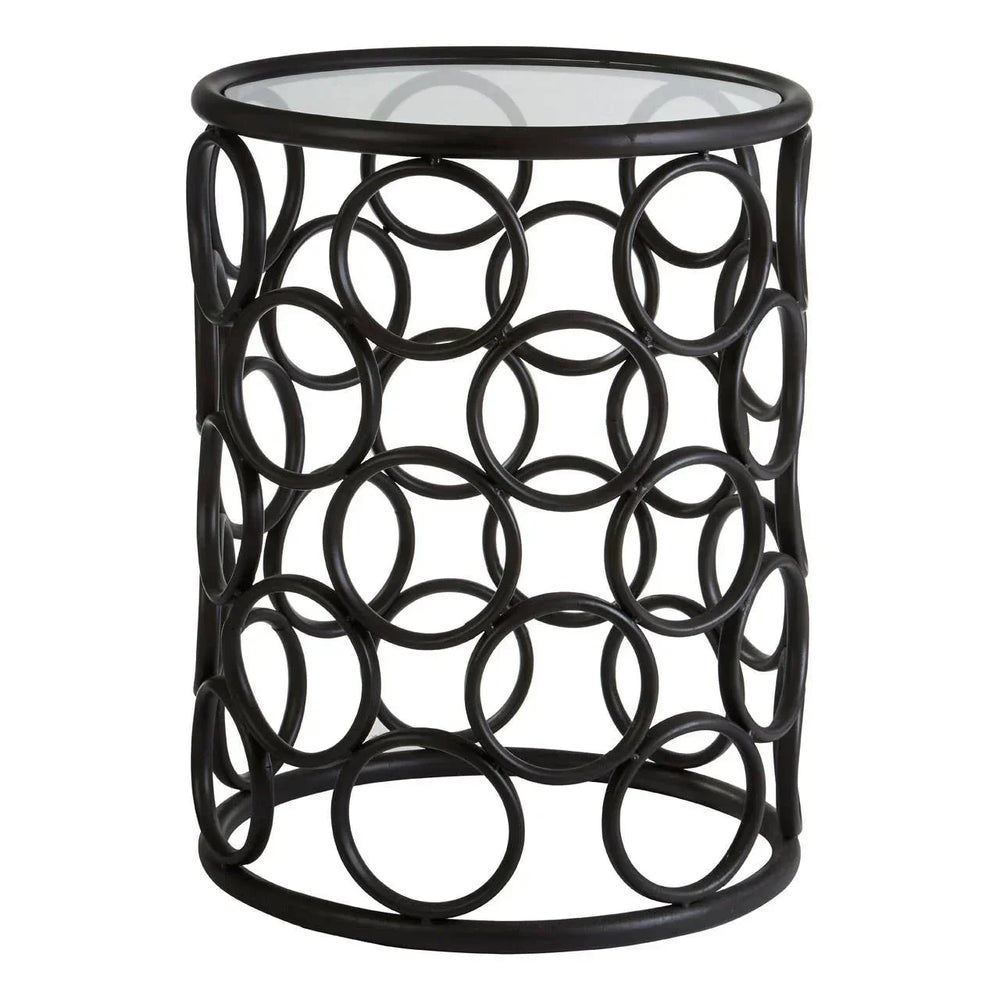 Round metal side table with geometric circular frame and glass top
