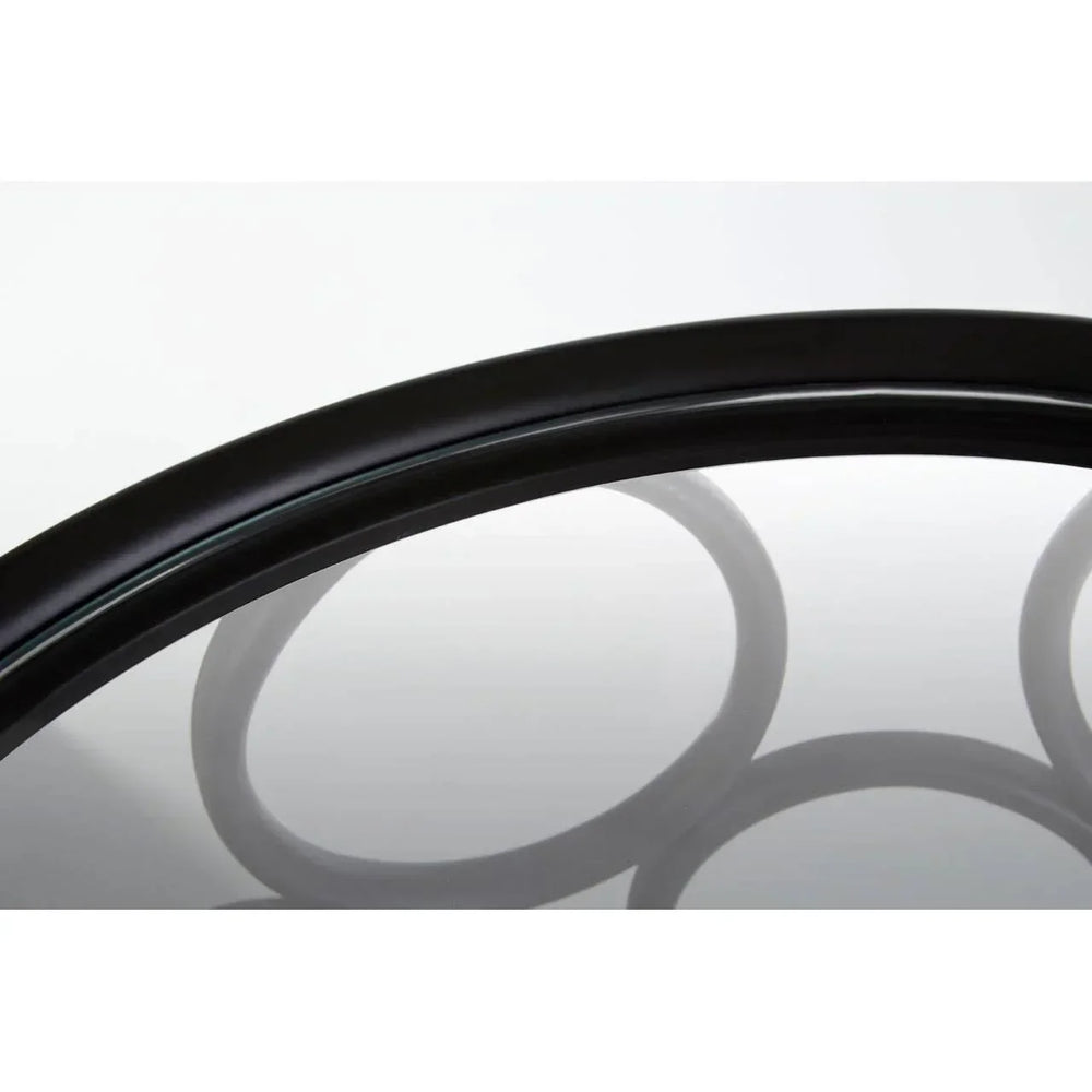 Black metal and glass coffee table edge with circular base detail