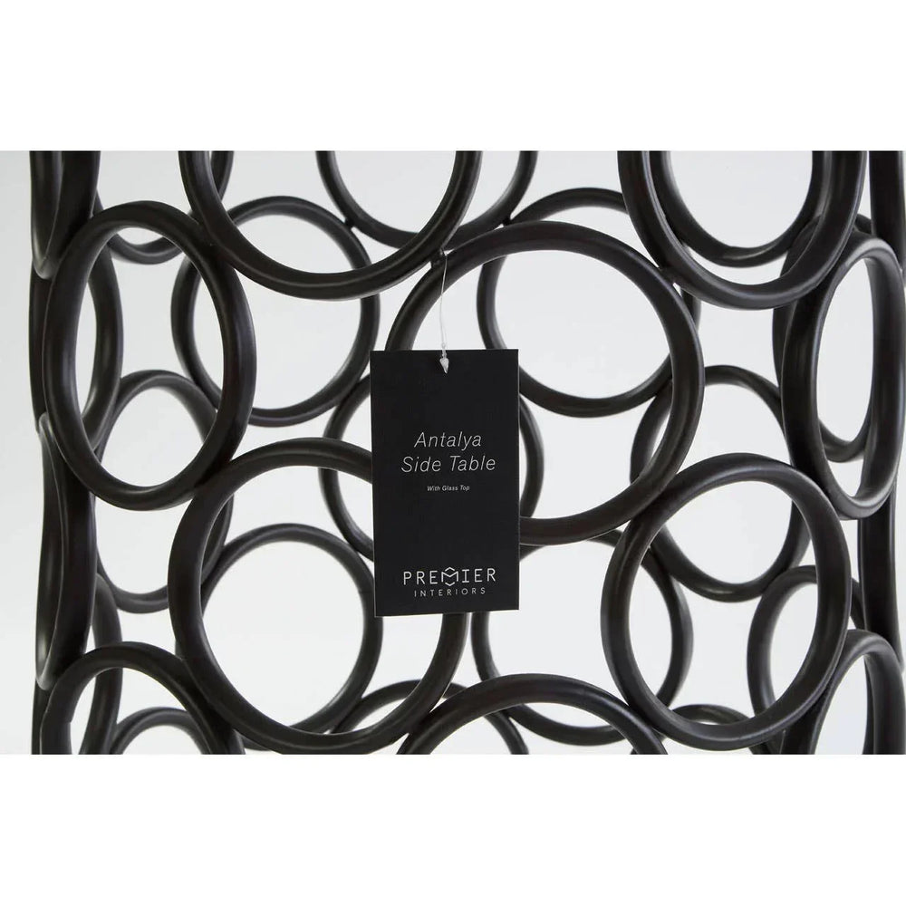 Black metal Antalya side table with circular frame design and product tag close-up