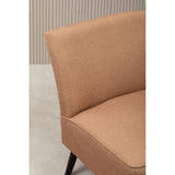 Closeup of tan fabric accent chair with black legs against a neutral background