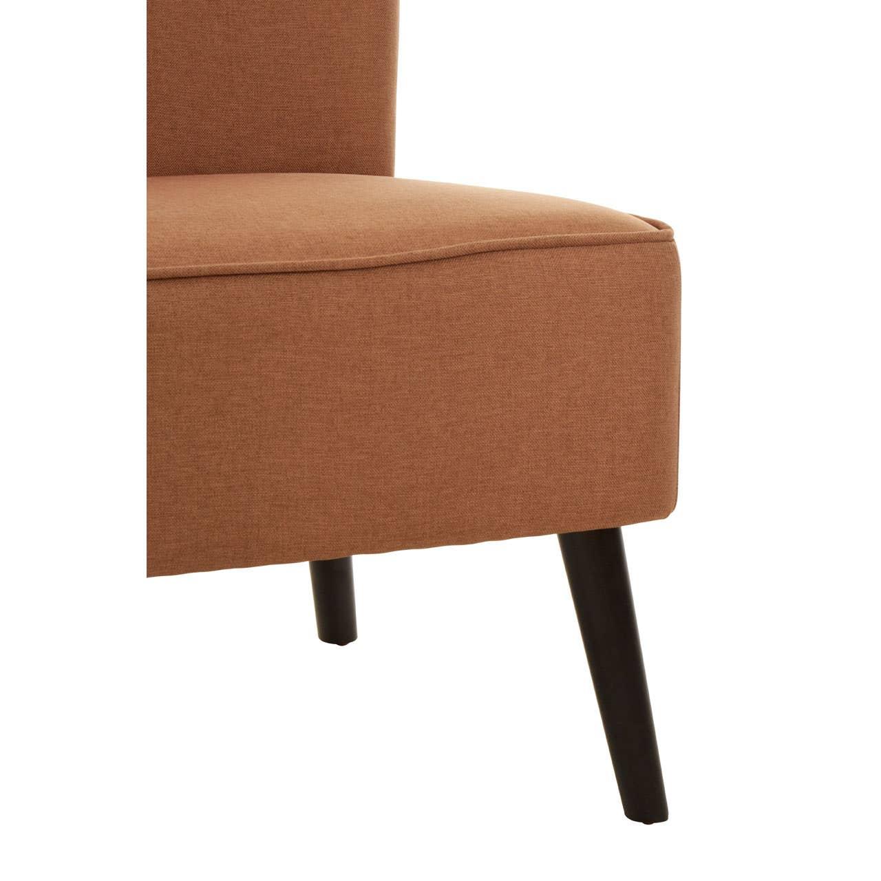 Closeup of brown fabric chair seat with black angled wooden legs