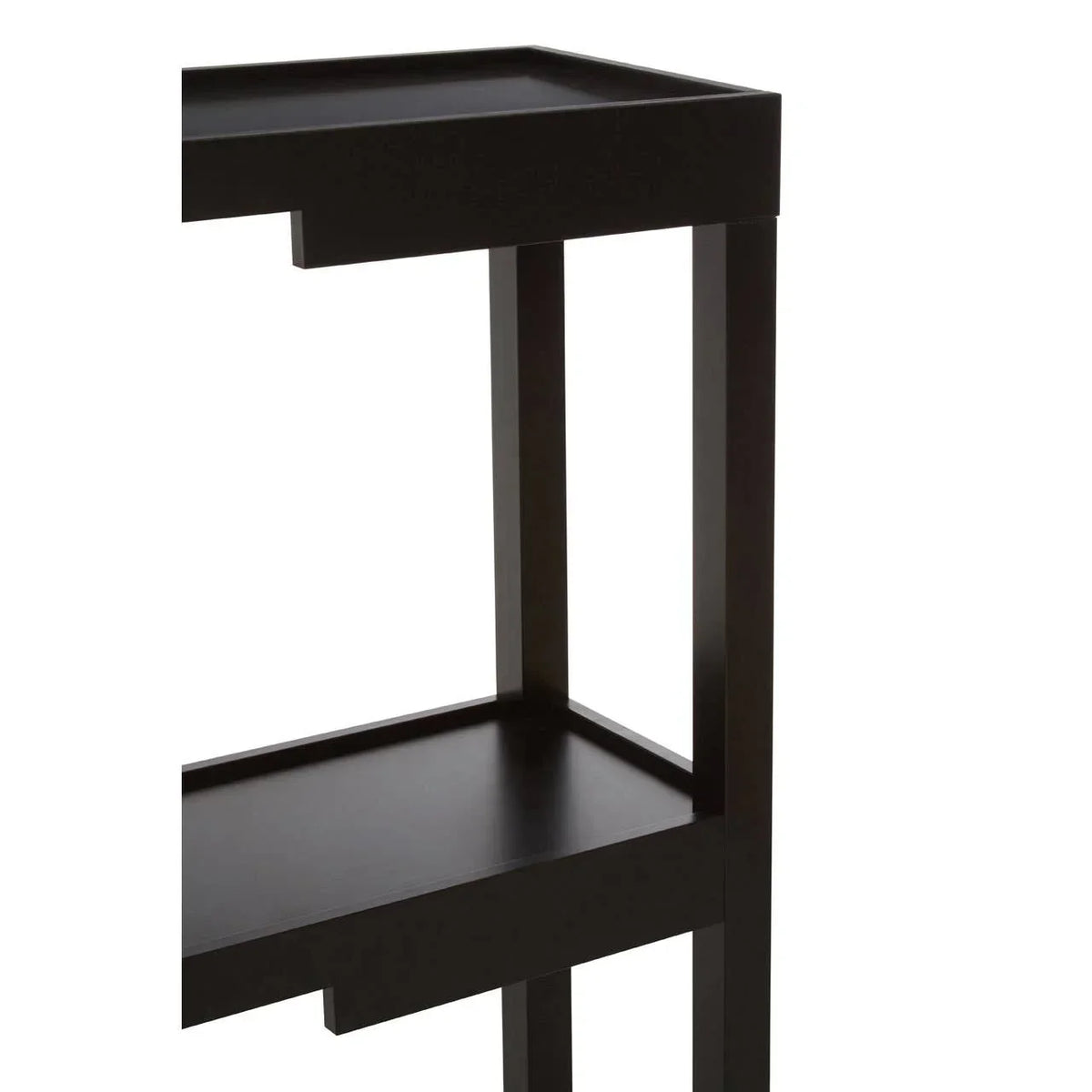 Black wooden side table with raised edge shelf, close-up of leg and shelf design