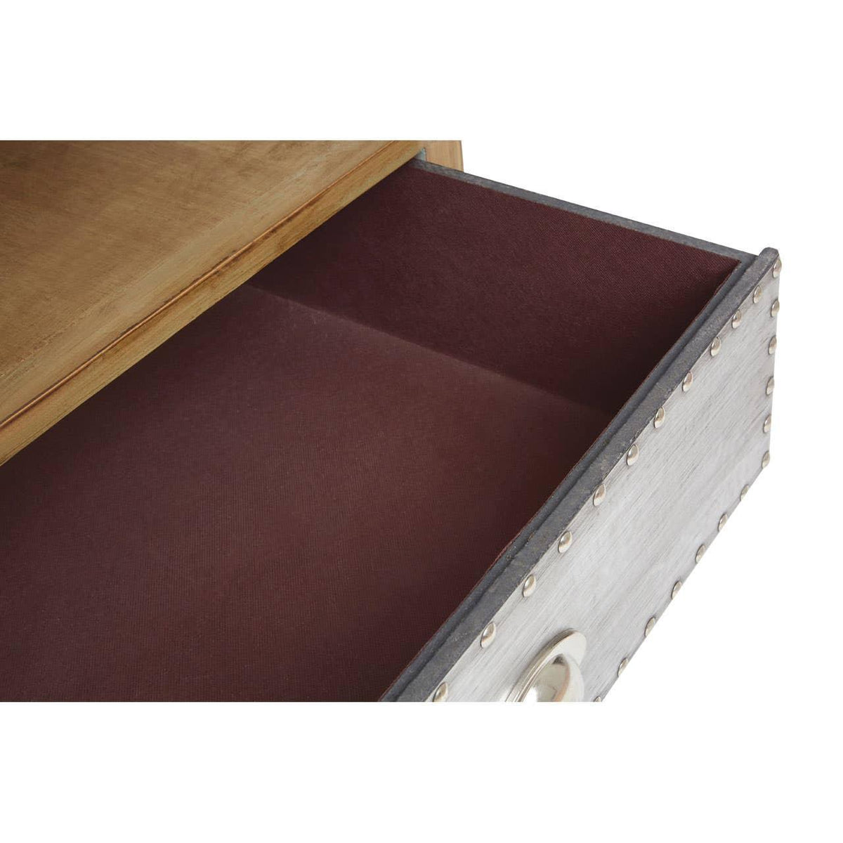 Closeup of open wooden drawer with metal rivet detail and silver handle