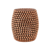 Copper finish barrel stool with a textured surface featuring a pattern of small, raised dots, creating a stylish and modern look. The stool has a rounded shape and a sturdy base, suitable for use as extra seating or a decorative accent in home interiors