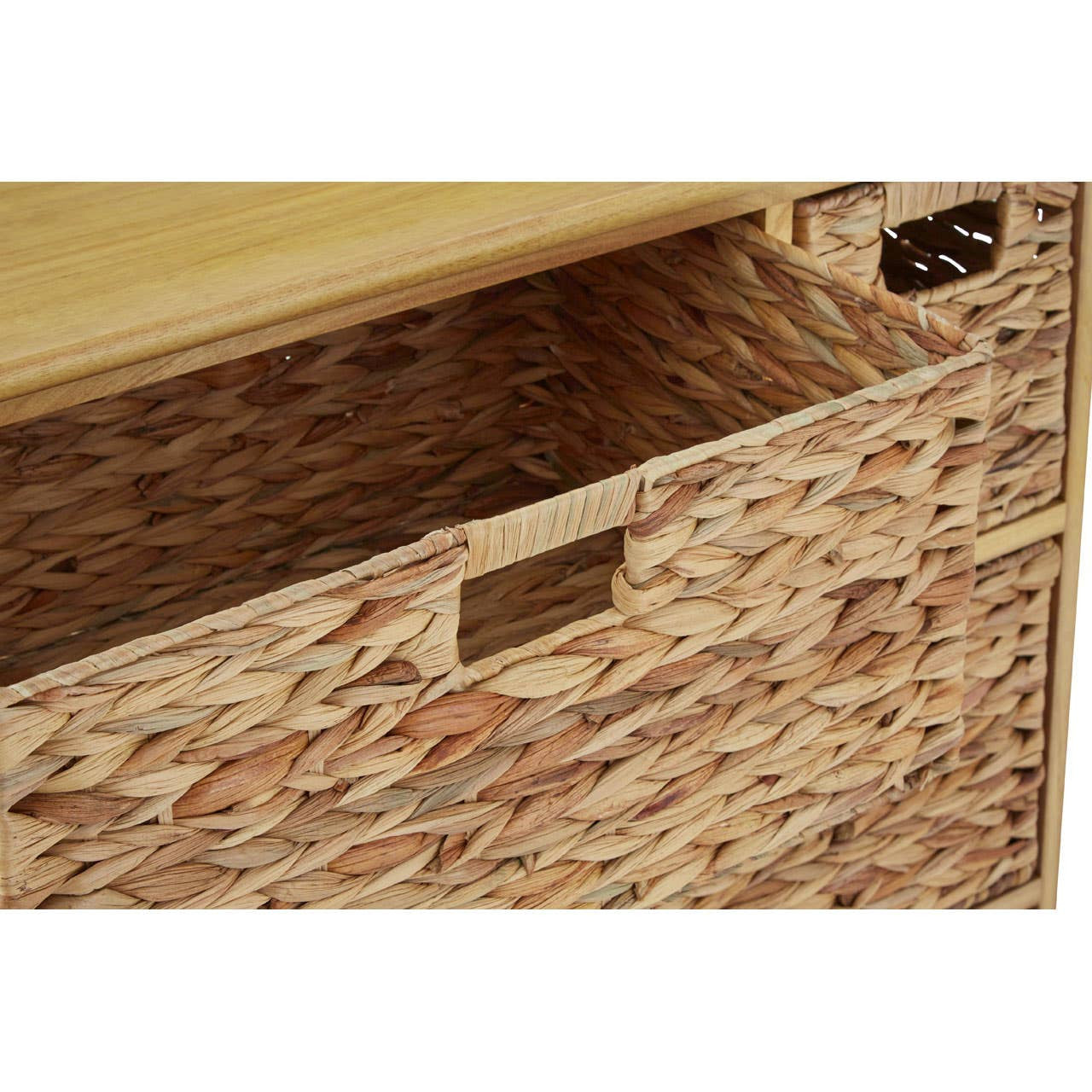A close-up view of the Padstow Storage Unit featuring a natural wood top and six woven water hyacinth drawers. One drawer is partially pulled out, showcasing its textured surface and cut-out handle. The overall design highlights a blend of natural materials and a functional storage solution
