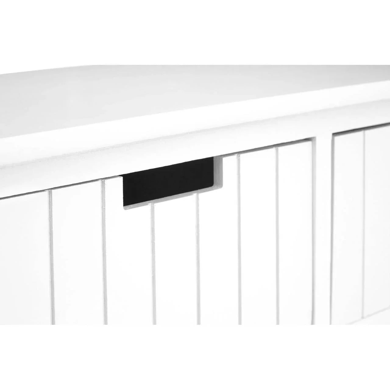 White wooden sideboard cabinet with vertical panel door and cut-out handle close-up