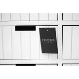 White wooden storage drawers with vertical grooves and Premier Interiors tag attached
