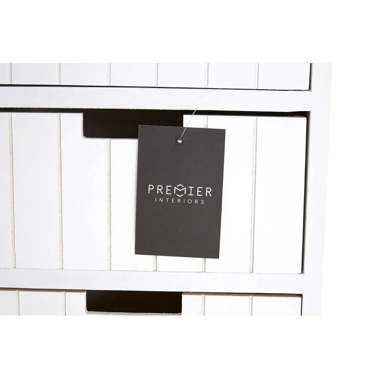 White wooden storage drawers with vertical panel design and black handle cutouts