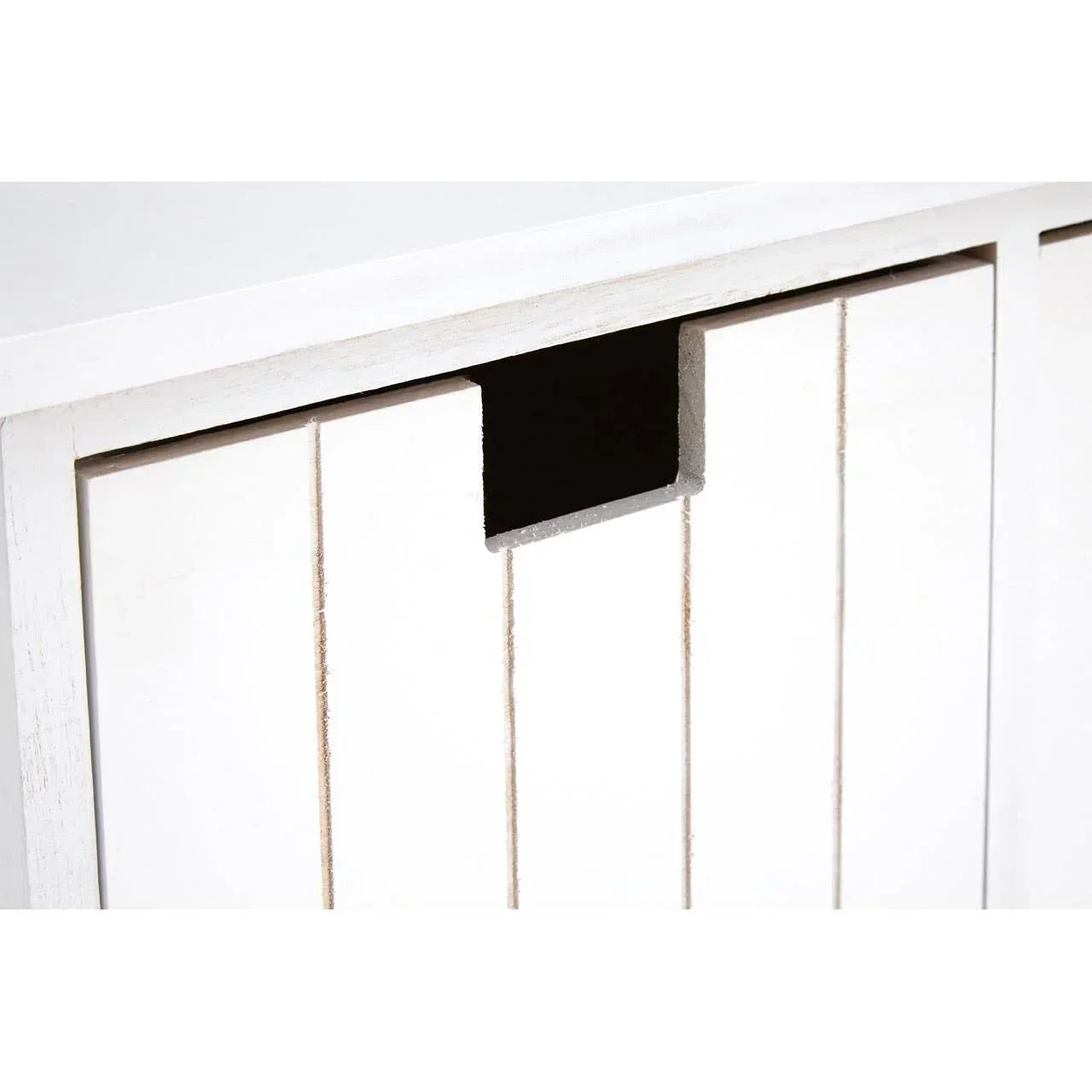 White wooden cabinet door with vertical slats and cut-out handle detail