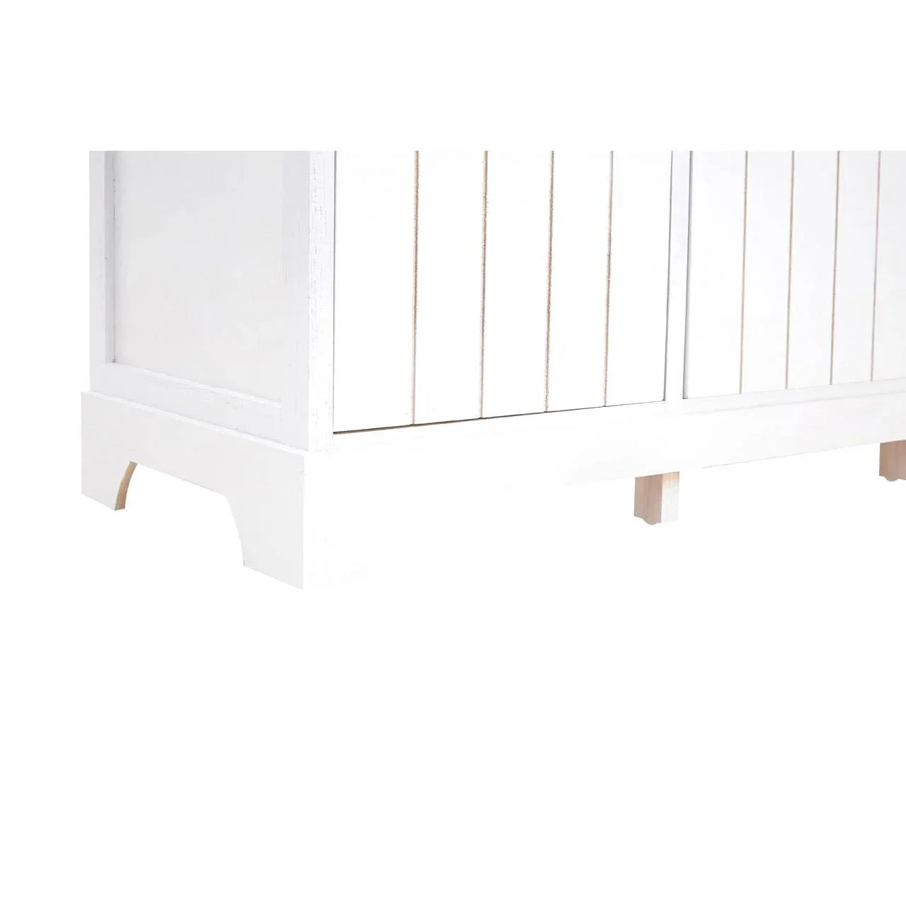Closeup of white wooden cabinet legs and panelled side