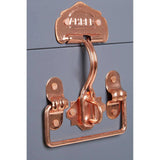 Copper trunk handle and latch on matte blue storage chest