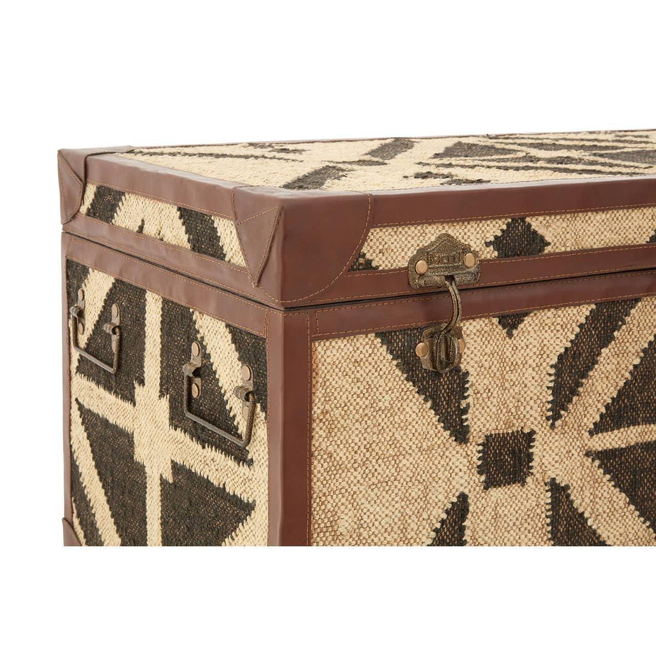 Patterned storage trunk with brown leather trim and metal handles