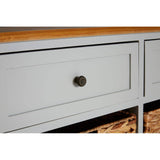 The Vermont Two Drawers Four Baskets Cabinet features a light gray finish with a smooth wooden top. It includes two spacious drawers with round bronze knobs and four woven baskets below, providing stylish storage options. The cabinet has clean lines and a modern design, suitable for various home decor styles