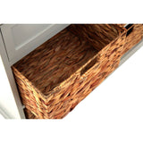 Close-up view of an open drawer from the Vermont Two Drawers Four Baskets Cabinet, showcasing a woven basket with a natural texture and a handle for easy access. The cabinet features a light-colored finish, complementing the warm tones of the basket