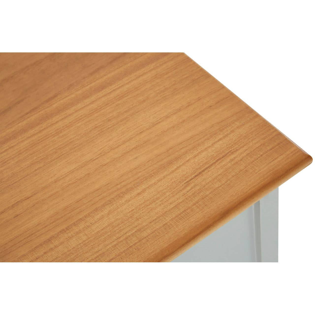Top view of a wooden cabinet featuring a smooth, light brown surface with a natural grain pattern, showcasing a corner edge