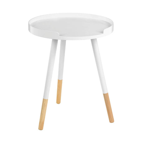 Round side table featuring a white top and three legs, two of which are white and one is natural wood, creating a modern and minimalist design suitable for home decor