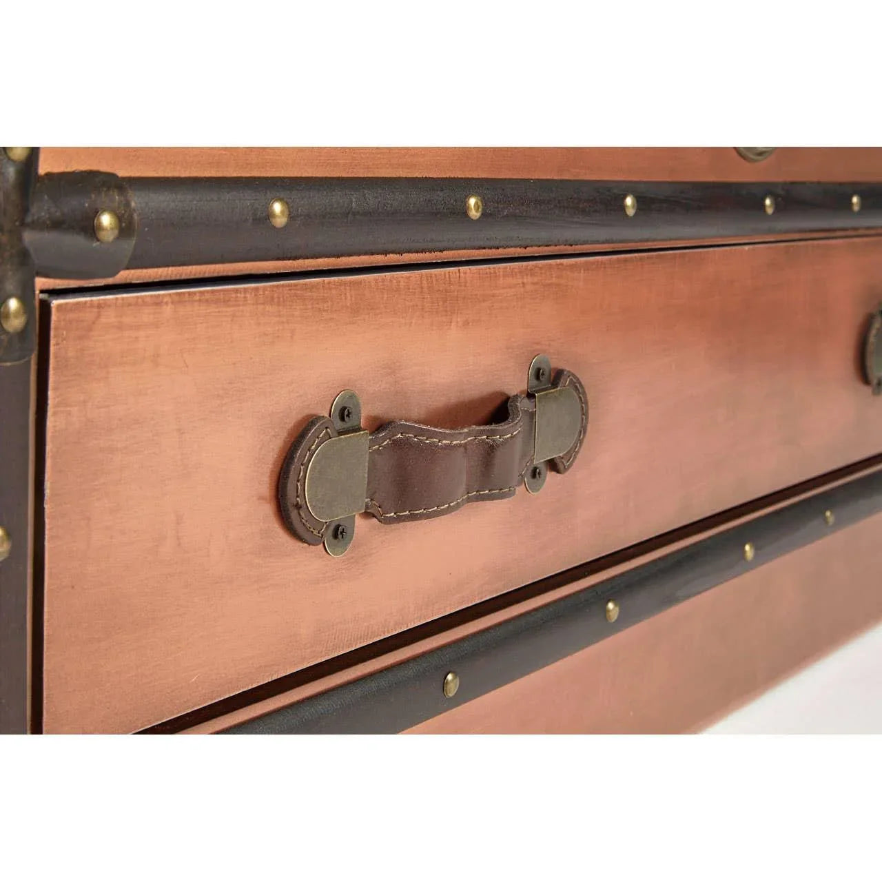 Closeup of vintage wood chest drawer with leather handle and metal rivet details