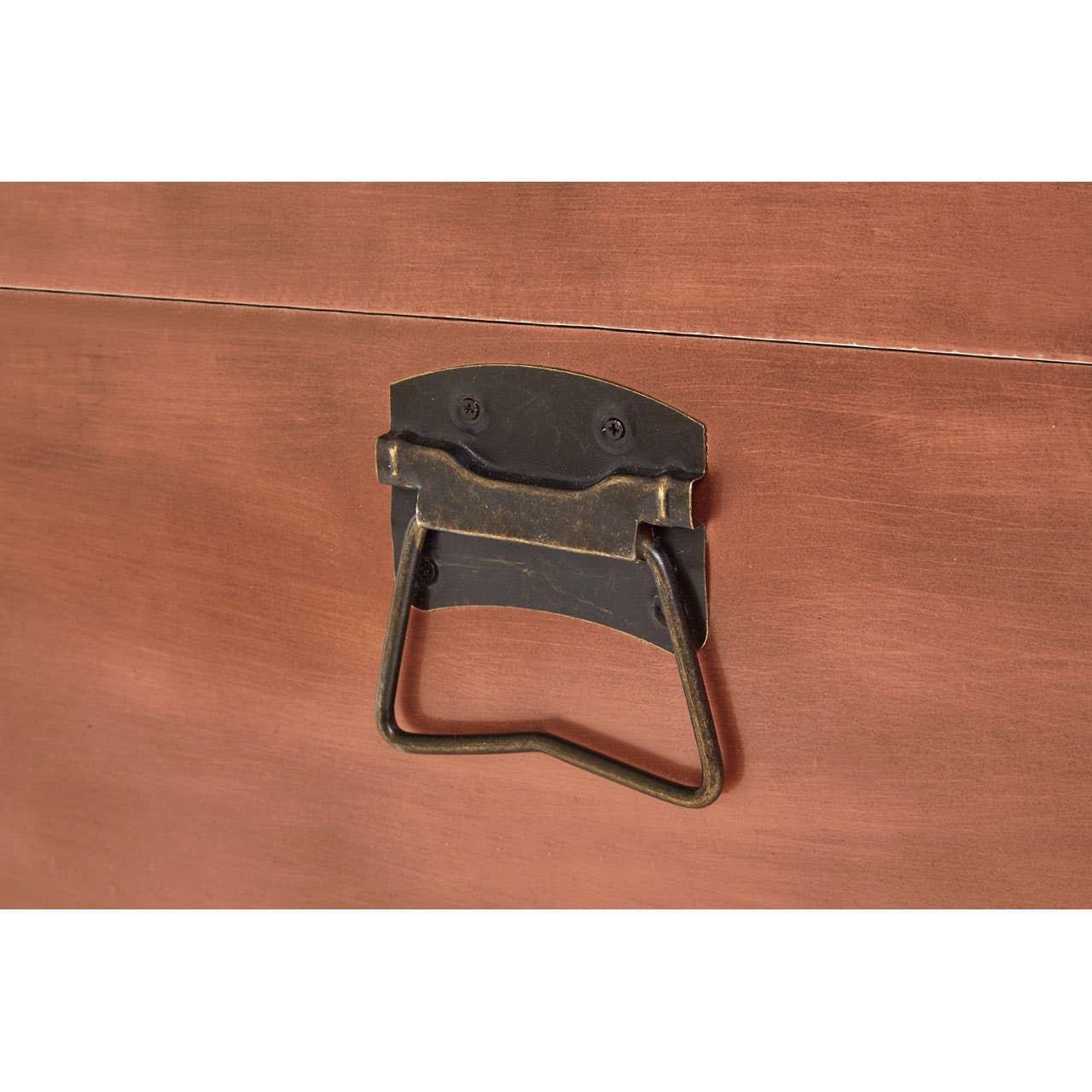 Close up of vintage metal handle on wooden furniture storage chest