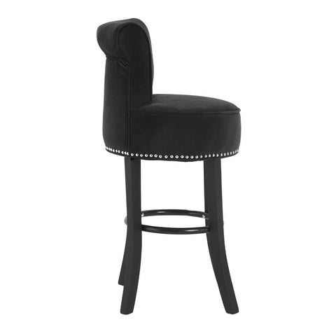 Black velvet bar stool with nailhead trim and curved backrest, side profile view