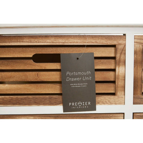Portsmouth 6 Drawers Unit featuring a white frame with wooden drawer fronts, showcasing six spacious drawers with horizontal slats and a tag attached that displays the product name and brand