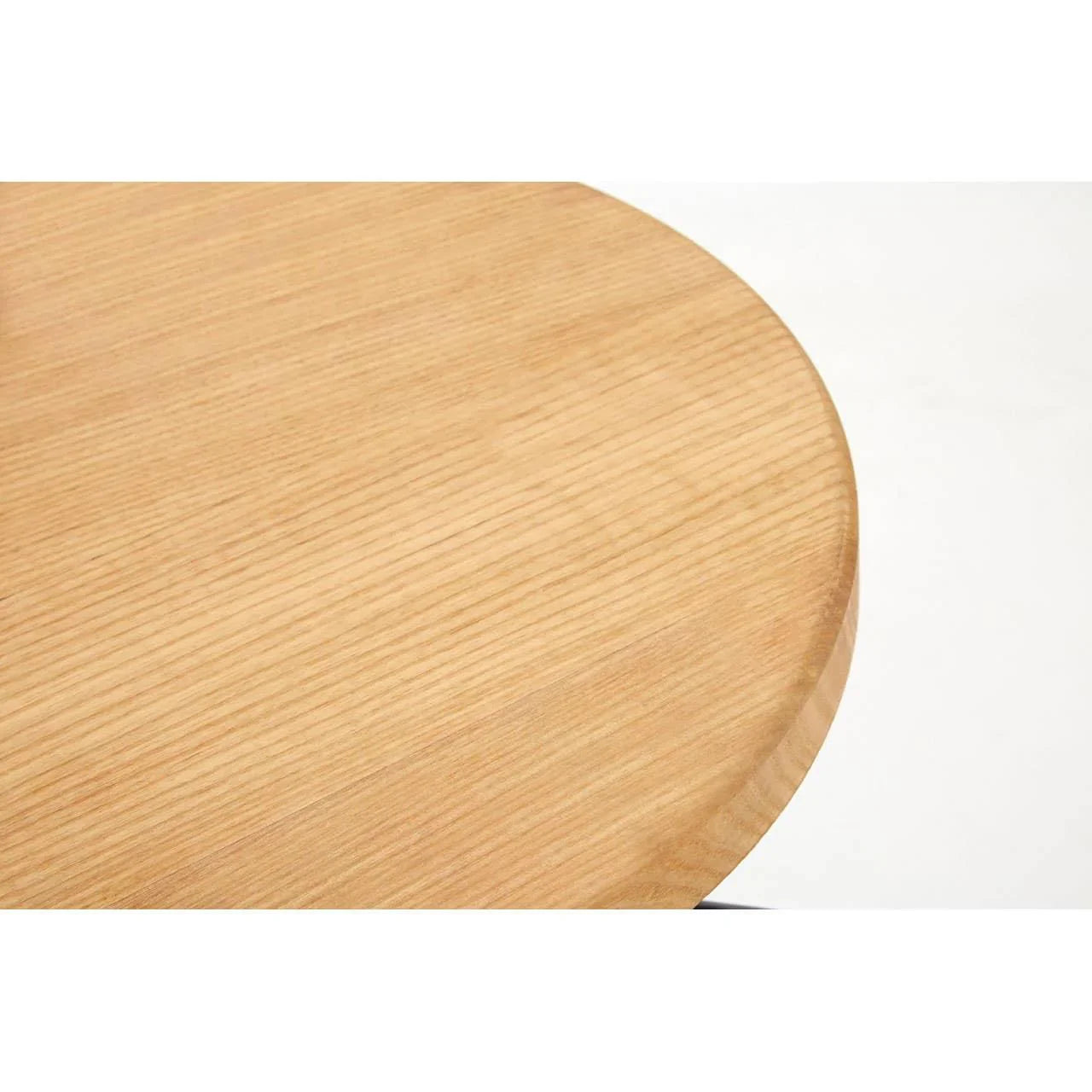 Closeup of round wooden table top with visible wood grain pattern