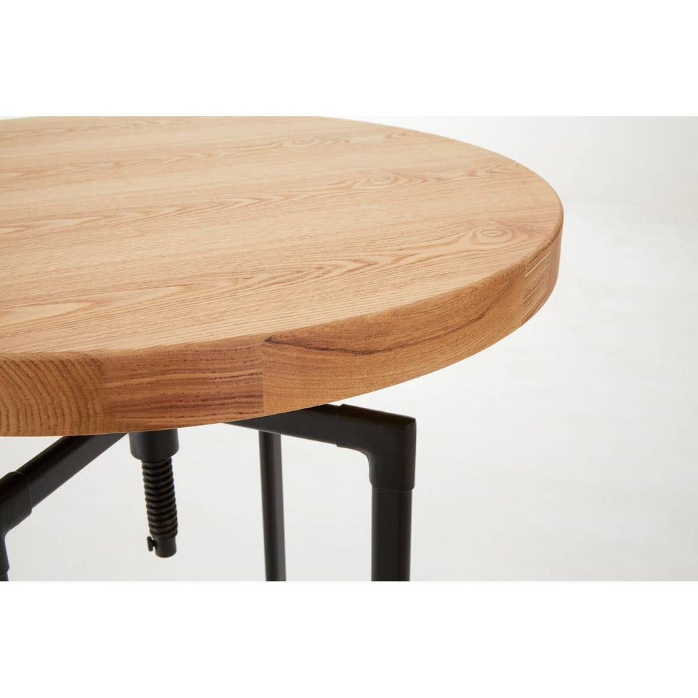 Round bar table featuring a smooth ash veneer top with a natural wood finish and a sturdy black metal base. The edges of the tabletop are slightly rounded, highlighting the wood grain