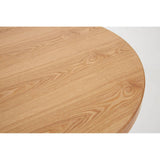 Close-up view of the round tabletop of the New Foundry Ash Veneer Bar Table, showcasing a smooth, light wood finish with natural grain patterns and a subtle sheen