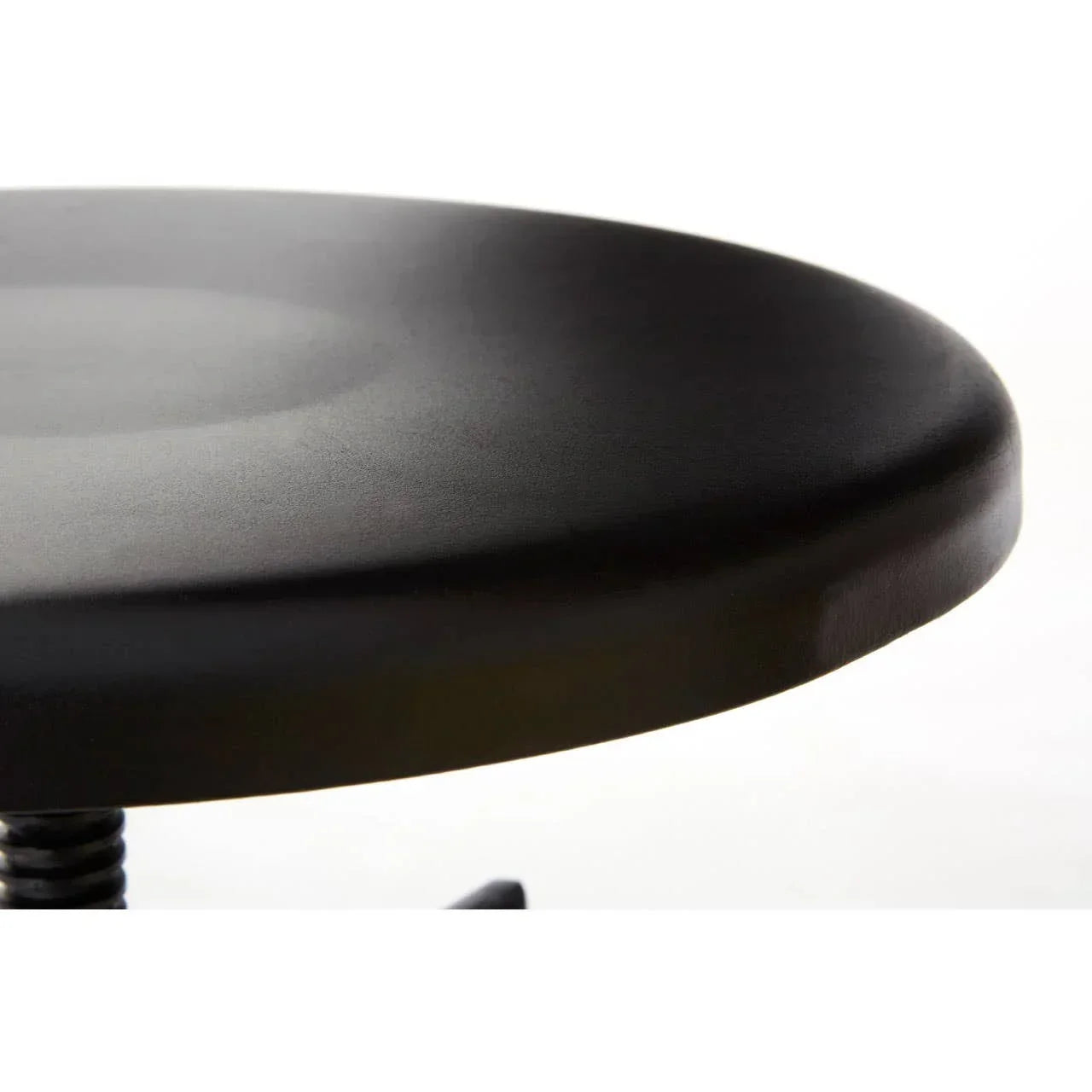Closeup of black round stool seat with smooth finish
