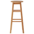 Tall bar stool made from natural tropical Hevea wood, featuring a round seat and four straight legs with a simple, minimalist design. The wood has a light finish that highlights its natural grain