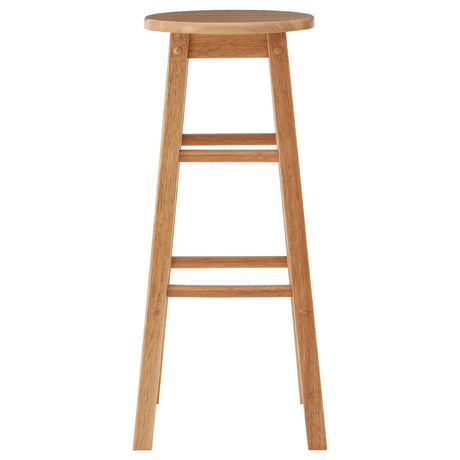 Tall bar stool made from natural tropical Hevea wood, featuring a round seat and four straight legs with a simple, minimalist design. The wood has a light finish that highlights its natural grain