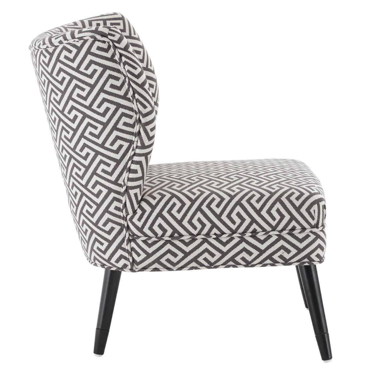 Accent chair with black and white geometric fabric and angled wooden legs, side view