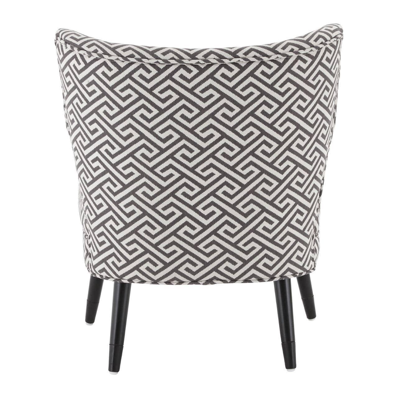 Accent chair with black and white geometric upholstery, rear view, black wooden legs