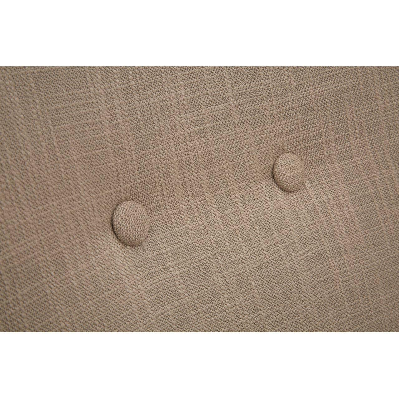 Beige fabric sofa backrest with two button tufted details, close-up texture view