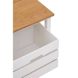 A close-up view of the Newport 2 Drawer Bench, featuring a light wooden top and a white base with two open drawers. The drawers are designed with a simple handle and are partially open, revealing their interior space. The overall design is modern and functional, suitable for home decor