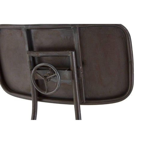 Industrial metal chair backrest with steering wheel detail, rustic finish