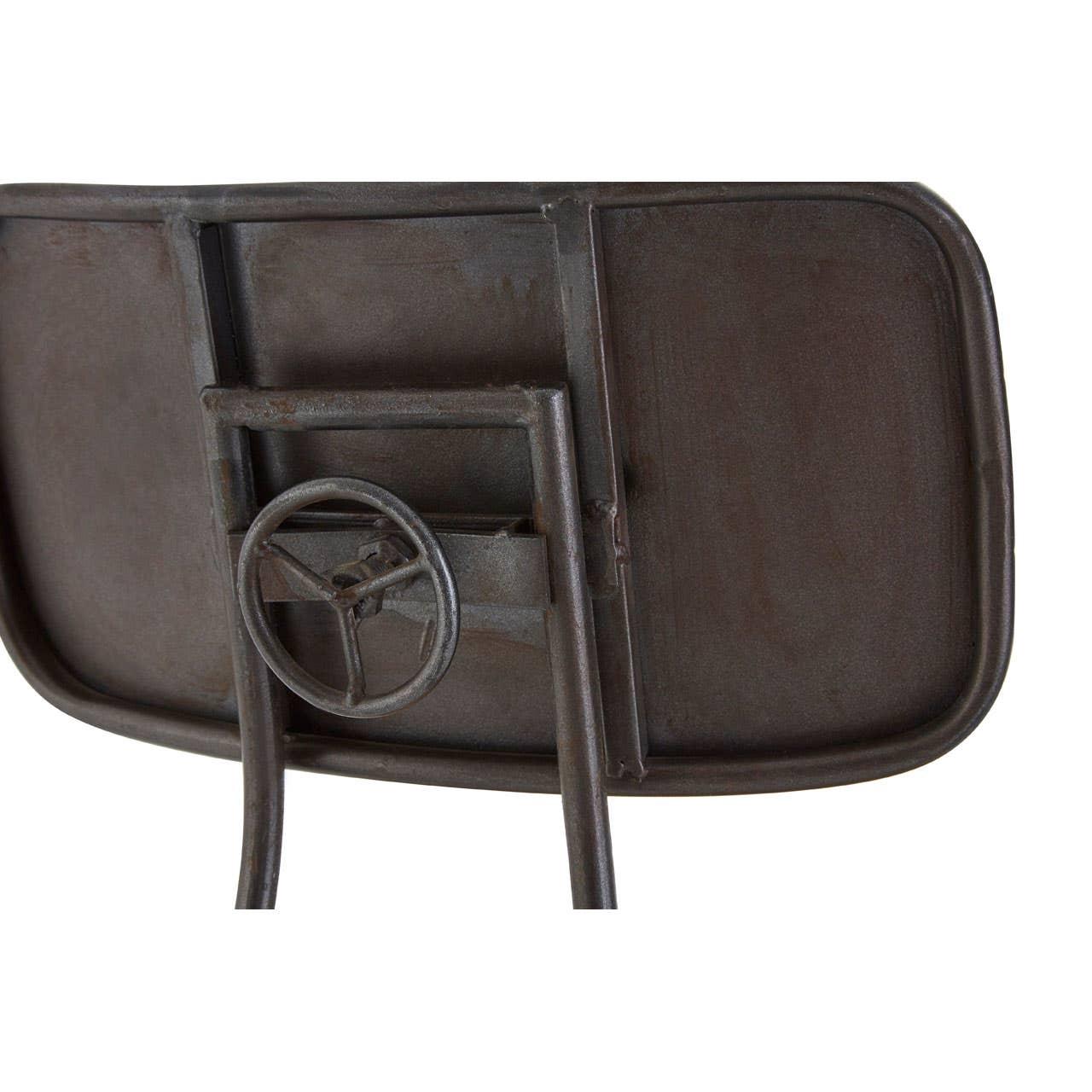 Industrial metal chair backrest with steering wheel detail, rustic finish