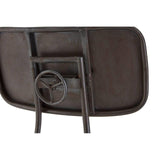 Industrial metal chair backrest with steering wheel detail, rustic finish