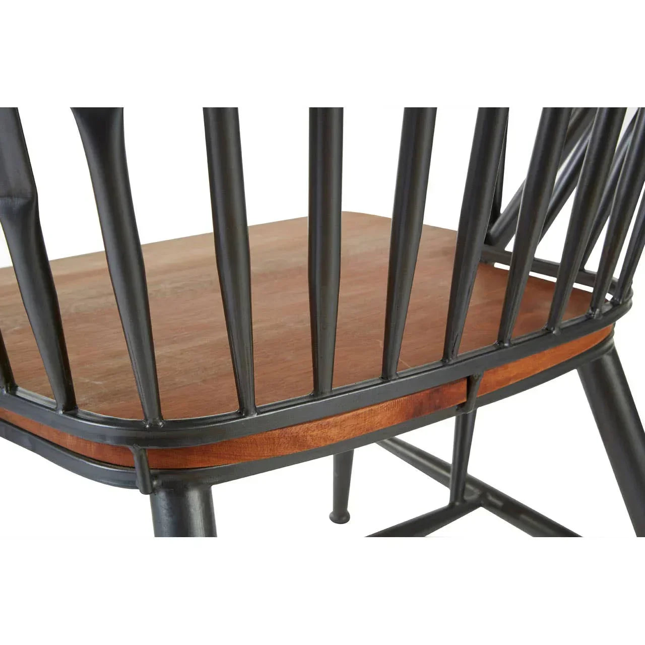 Detail of dining chair with black metal spindles and wooden seat