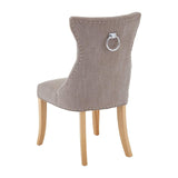Taupe fabric dining chair with ring handle, stud trim, and light wooden legs, rear view