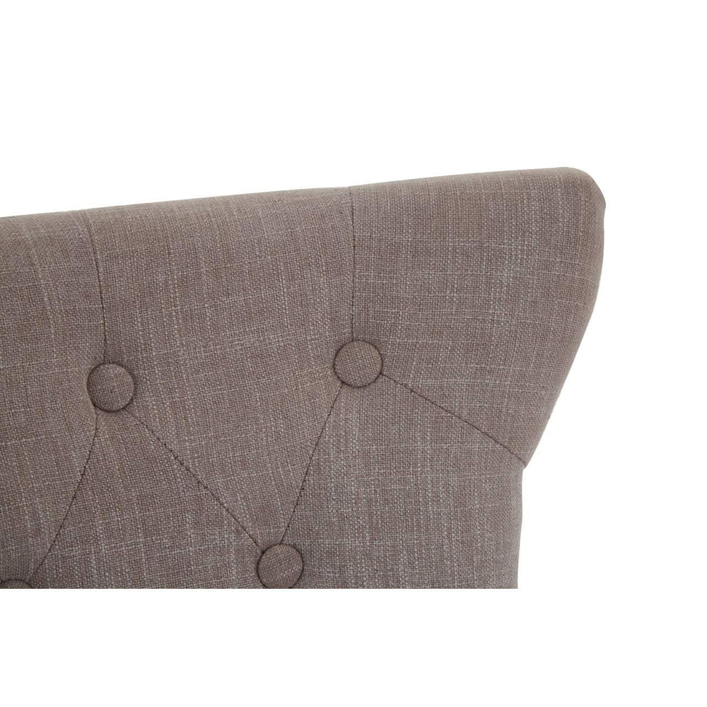 Brown fabric headboard with button-tufted detail and textured upholstery, angled side view