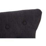 Dark fabric upholstered chair back with button tufting detail